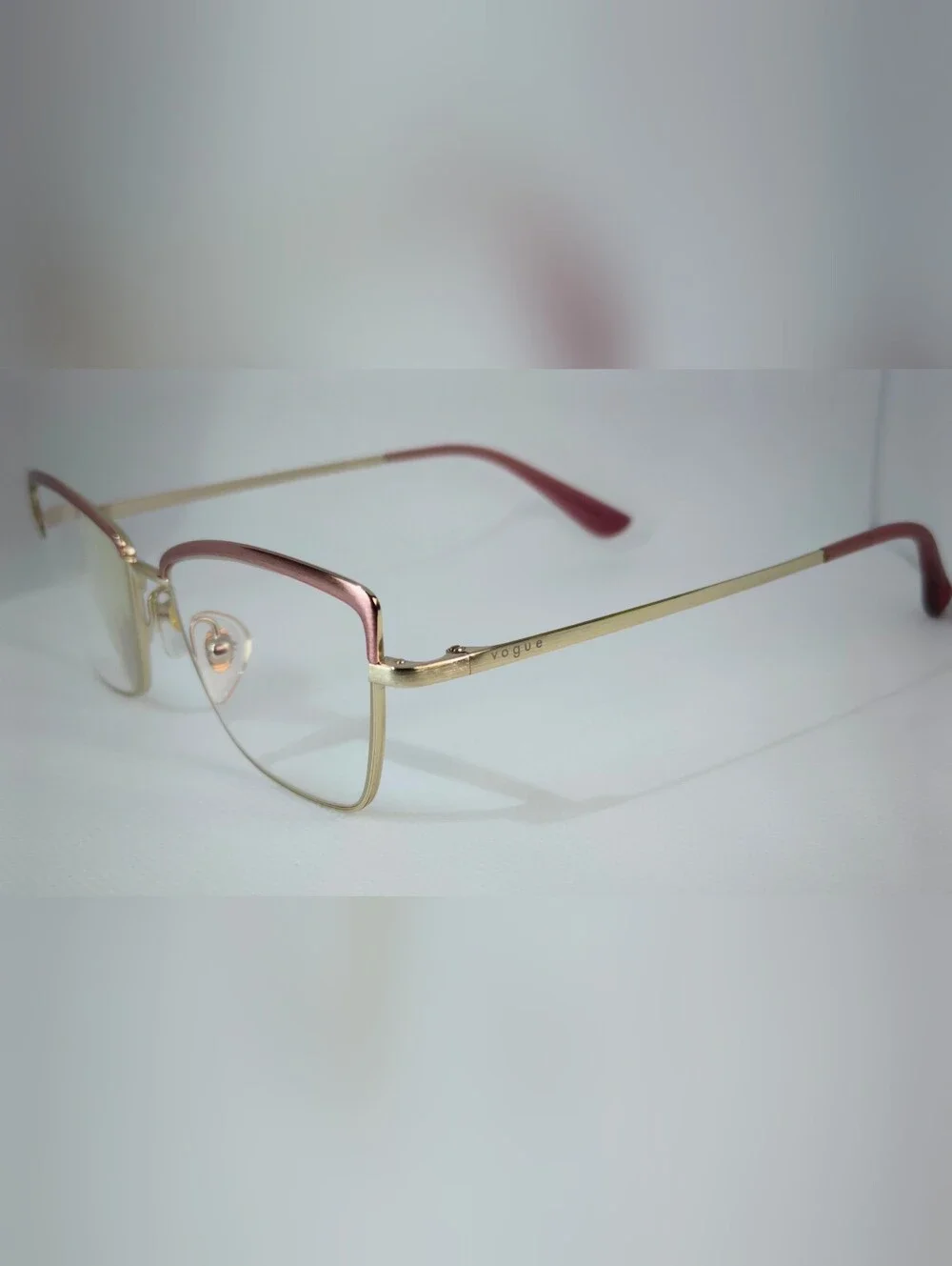 Vogue. Stylish Cat-Eye Metal Frame Glasses in Rose Gold Silk Texture.